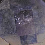 Fluorite (alternating color faces, internal bubbles)