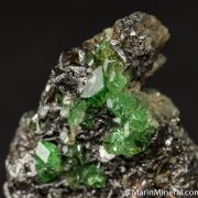 Tsavorite on Graphite