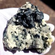 Hematite ( var. Iron Roses ) on K-Feldspar ( var. Adularia )