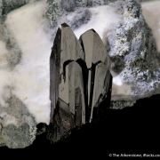 Neptunite on Natrolite