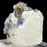 Zoisite var. tanzanite, calcite, graphite