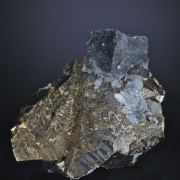 Bismuthinite inside Fluorite on Arsenopyrite
