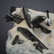Neptunite on Natrolite