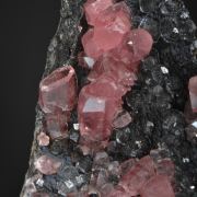 Rhodochrosite on Fluorite with Goethite