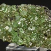 Tsavorite on Graphite