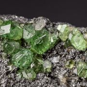 Tsavorite on Graphite