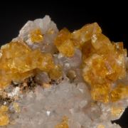 Barite (gemmy golden) on Quartz w. Fluorite
