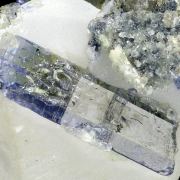 Zoisite var. tanzanite, calcite, graphite
