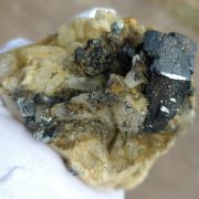 Hematite ( var. Eisenrose ) on Adularia with Rutile and Quartz