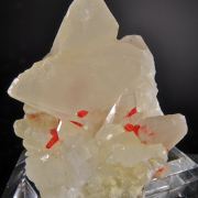 Realgar in and on  Calcite