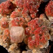 Calcite enclosing Hematite (2 generations)
