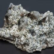 Bertrandite with Quartz (variety smoky) and Pyrite
