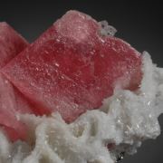 Rhodochrosite- sharp rhombs with Quartz, Pyrite and Calcite