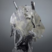 Stibnite in and on Calcite