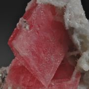 Rhodochrosite- sharp rhombs with Quartz, Pyrite and Calcite
