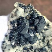 Hematite ( var. Iron Roses ) on K-Feldspar ( var. Adularia )