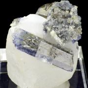 Zoisite var. tanzanite, calcite, graphite
