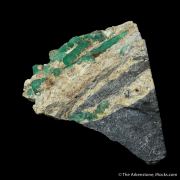 Beryl var. Emerald, on Calcite