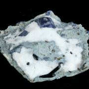 Benitoite with Neptunite and Joaquinite on Natrolite