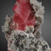 Rhodochrosite- sharp rhombs with Quartz, Pyrite and Calcite
