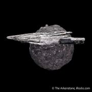 Stibnite on Calcite included by Boulangerite