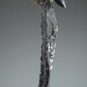 Silver, elongated spinel-twin, floater