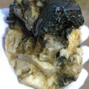 Hematite ( var. Eisenrose ) on Adularia with Rutile and Quartz