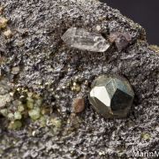 Tsavorite, Pyrite, Quartz, Diopside on Graphite