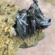 Stibnite on Quartz with Siderite