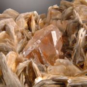 Fluorite (Pink- Orange Octahedral) on Muscovite