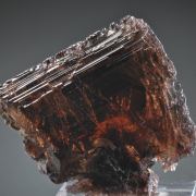 Axinite (Fe) etched gem crystal
