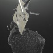 Stibnite in and on Calcite