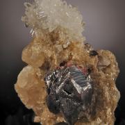 Cinnabar (twinned crystals on Quartz and Calcite)