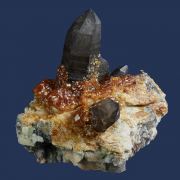 Spessartine garnet on Quartz (Smoky) with Orthoclase