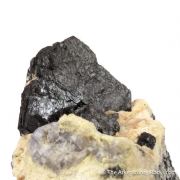 Hibonite in matrix