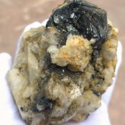 Hematite ( var. Eisenrose ) on Adularia with Rutile and Quartz