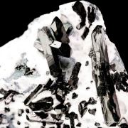 Neptunite on Natrolite