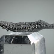 Silver, elongated spinel-twin, floater