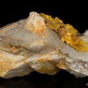 Wakabayashilite on Calcite