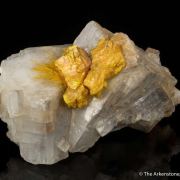 Wakabayashilite on Calcite