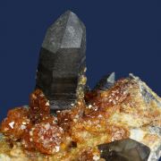 Spessartine garnet on Quartz (Smoky) with Orthoclase