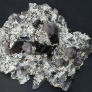 Bertrandite with Quartz (variety smoky) and Pyrite