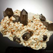 Spessartine Garnet and Smoky Quartz on Feldspar