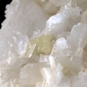 Milarite on Valencianite and Quartz