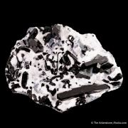 Neptunite on Natrolite