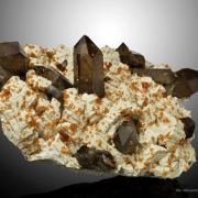 Spessartine Garnet and Smoky Quartz on Feldspar
