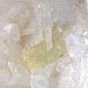 Milarite on Valencianite and Quartz