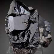 Cassiterite -huge for locale, with Ferberite, Arsenopyrite, Chalcopyrite, Quartz, Muscovite, Stannite,  Fluorite etc. 