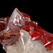 Realgar crystals on Calcite