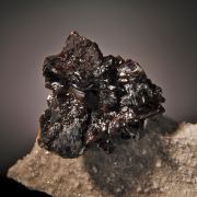 Sphalerite (red-black crystals) on Calcite with Fluorite
